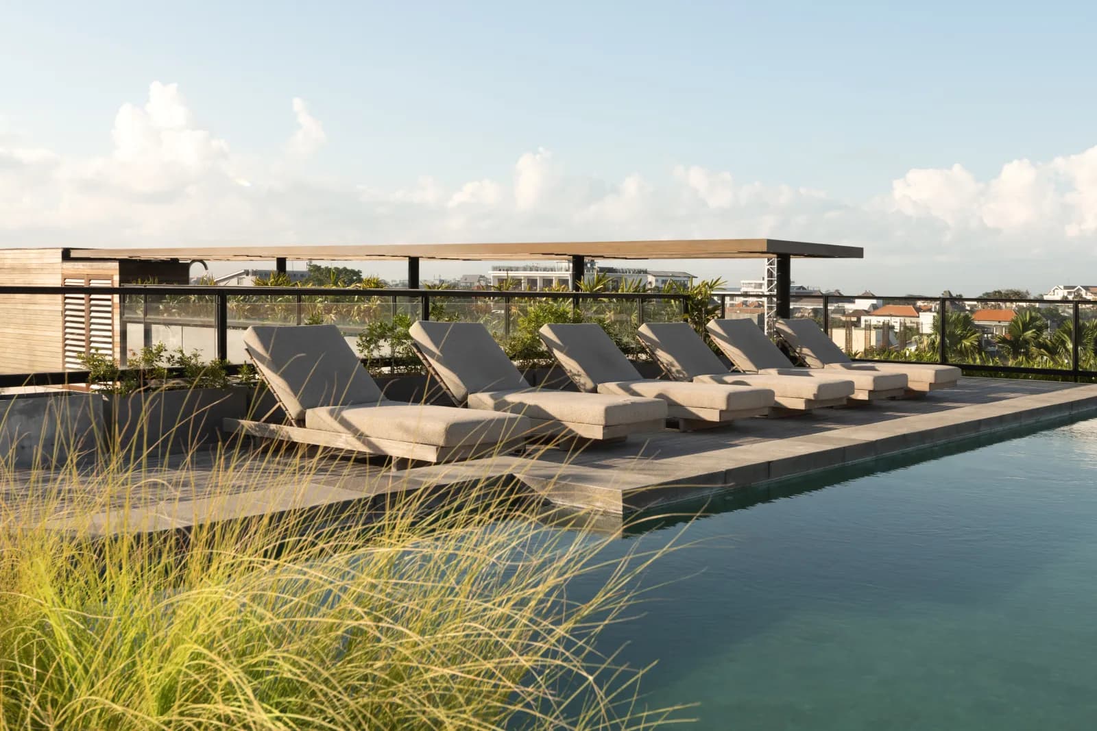 Loungers beside the rooftop pool at the completed Lifestyle Residence Canggu