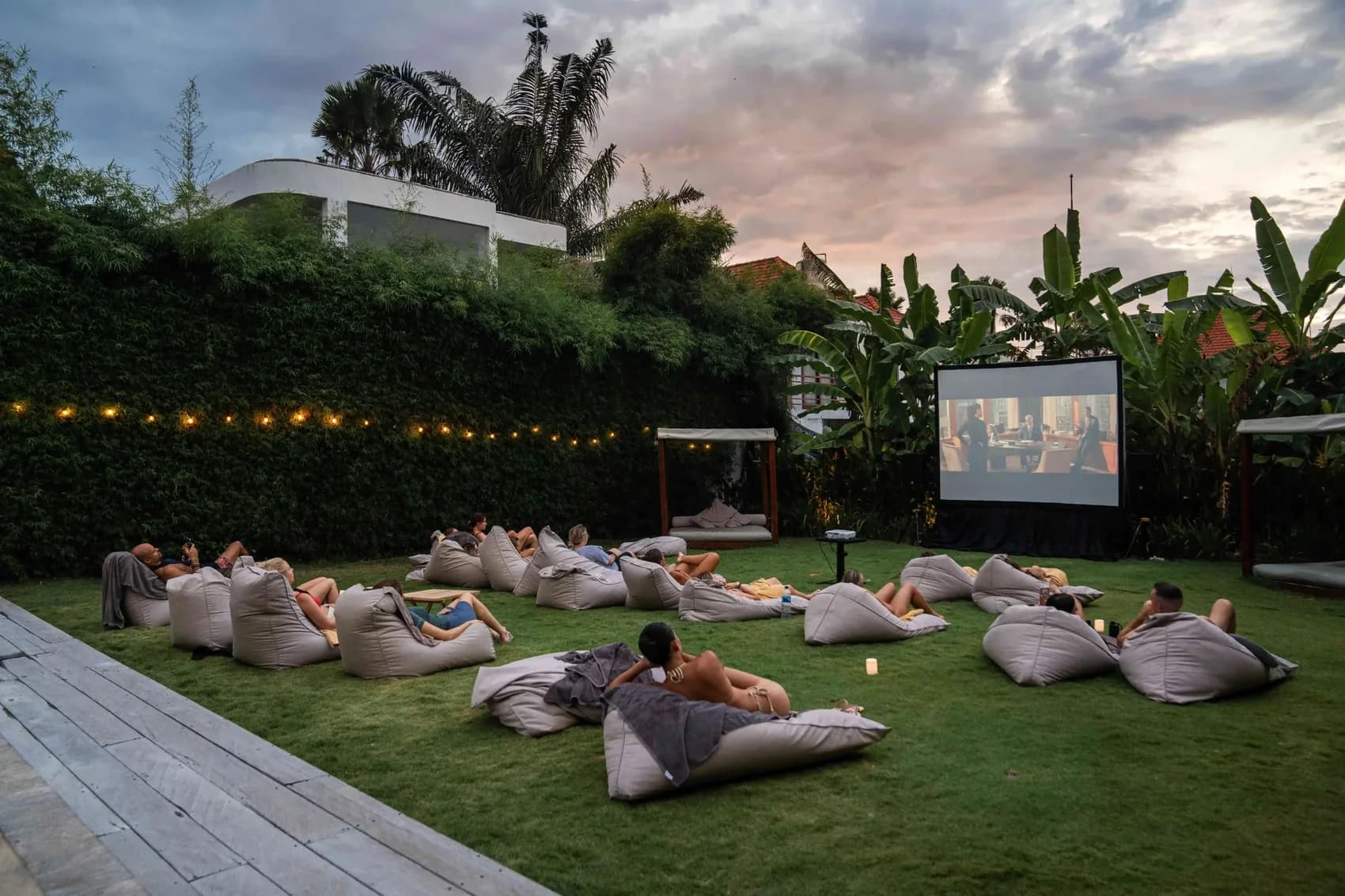 Members gathered on beanbags for an outdoor film night at Body Factory Canggu